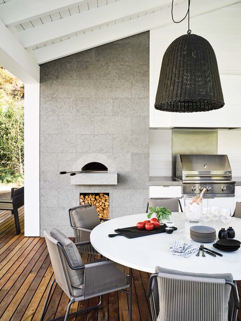 outdoor kitchen with wood decking and pizza oven