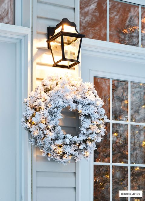 White, Christmas decoration, Home, Wreath, Lighting, Room, Window, Interior design, House, Lantern, 