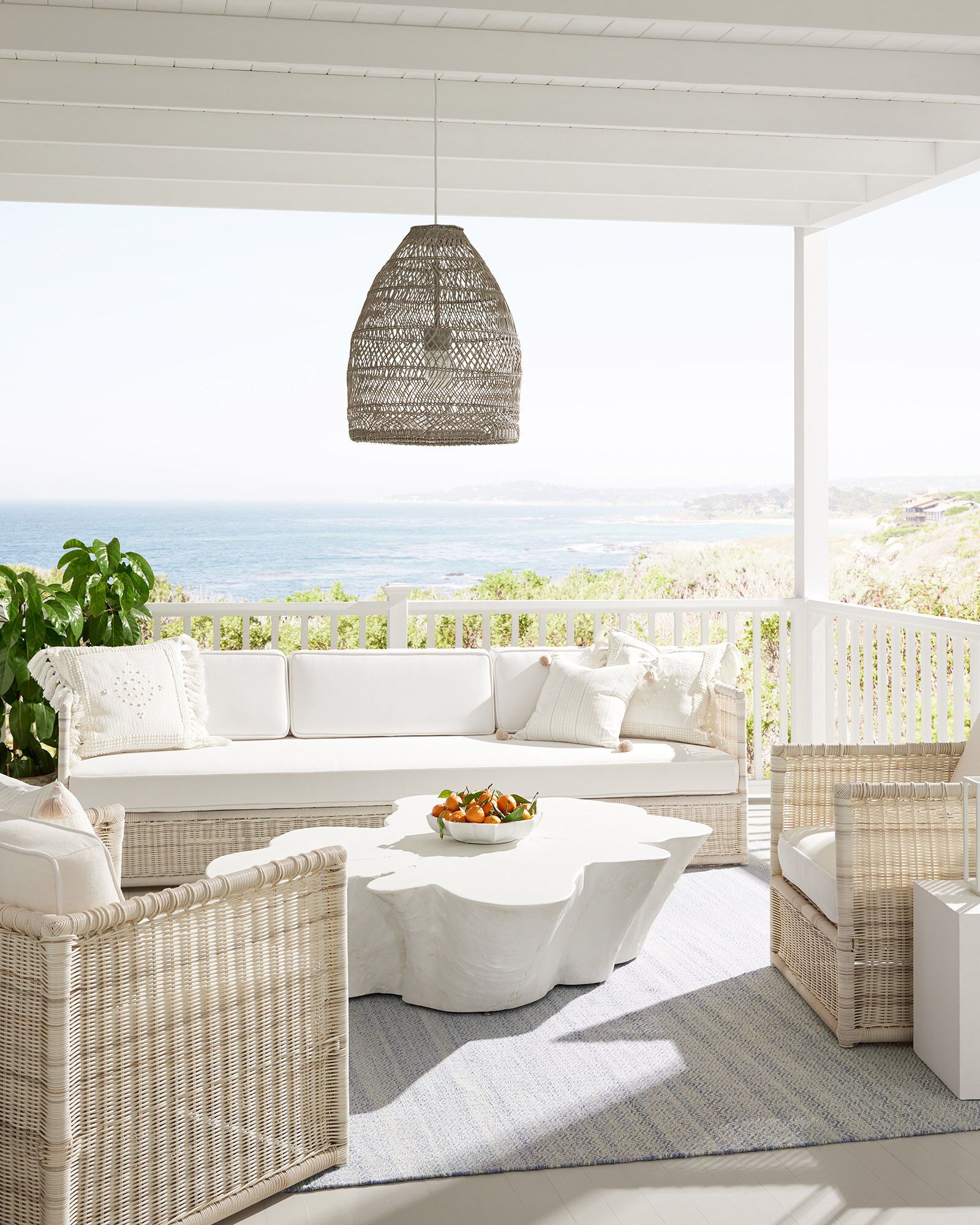 https://hips.hearstapps.com/hmg-prod/images/outdoor-living-room-pacifica-sofa-chair-x0211-1675092617.jpeg