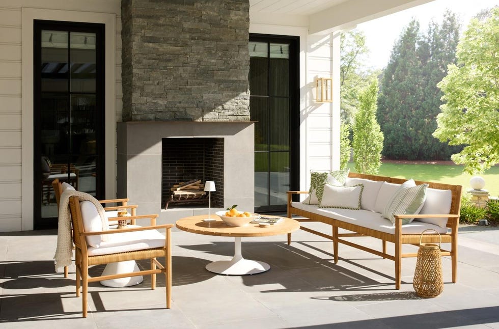 outdoor seating area with a fireplace and decorative elements