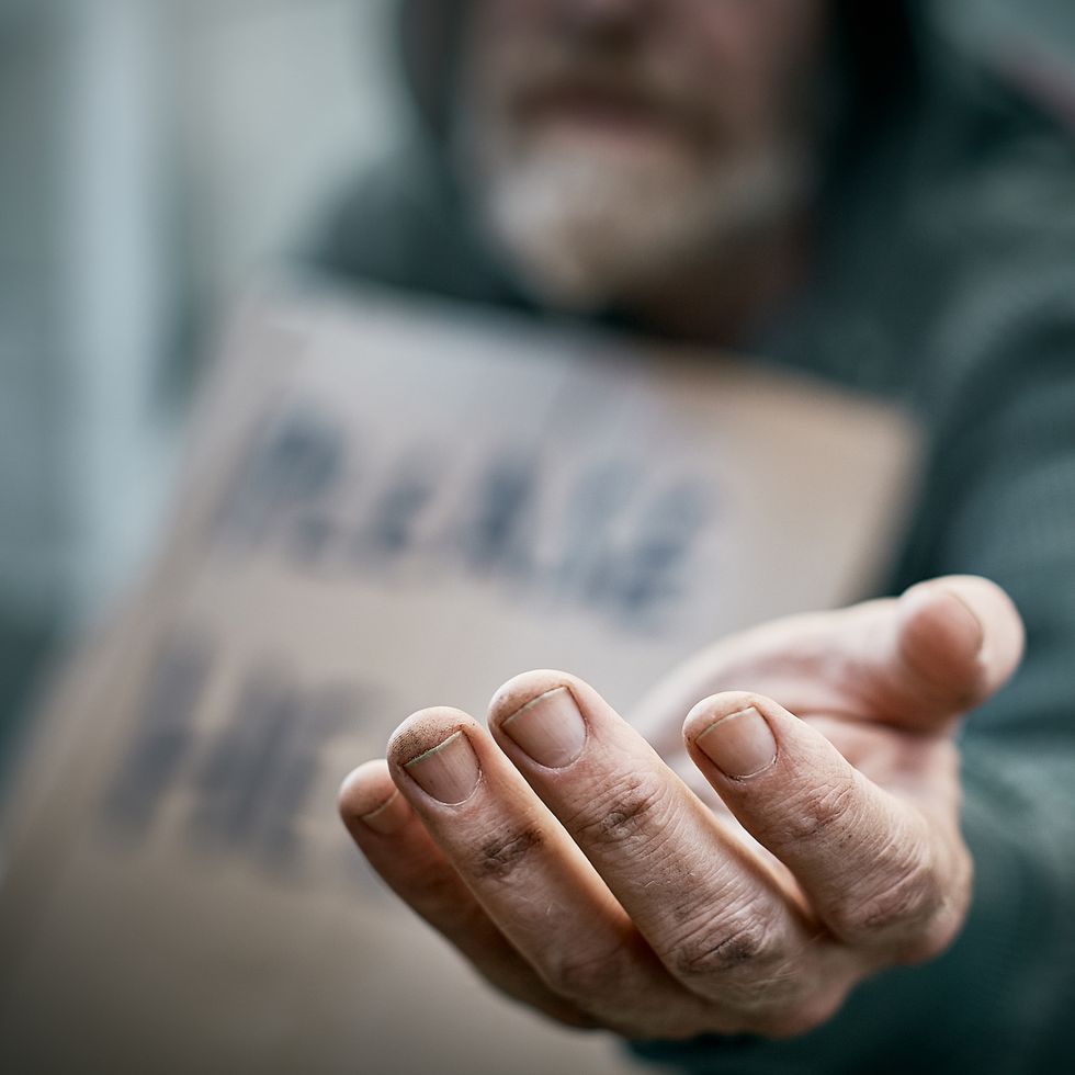 outstretched hand of pathetic beggar