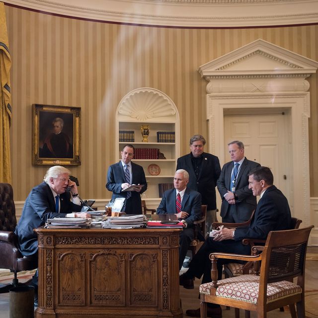 washington, dc   january 28 president donald trump speaks on the phone with russian president vladimir putin in the oval office of the white house, january 28, 2017 in washington, dc also pictured, from left, white house chief of staff reince priebus, vice president mike pence, white house chief strategist steve bannon, press secretary sean spicer and national security advisor michael flynn on saturday, president trump is making several phone calls with world leaders from japan, germany, russia, france and australia photo by drew angerergetty images