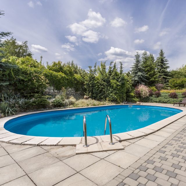Oval swimming pool in garden