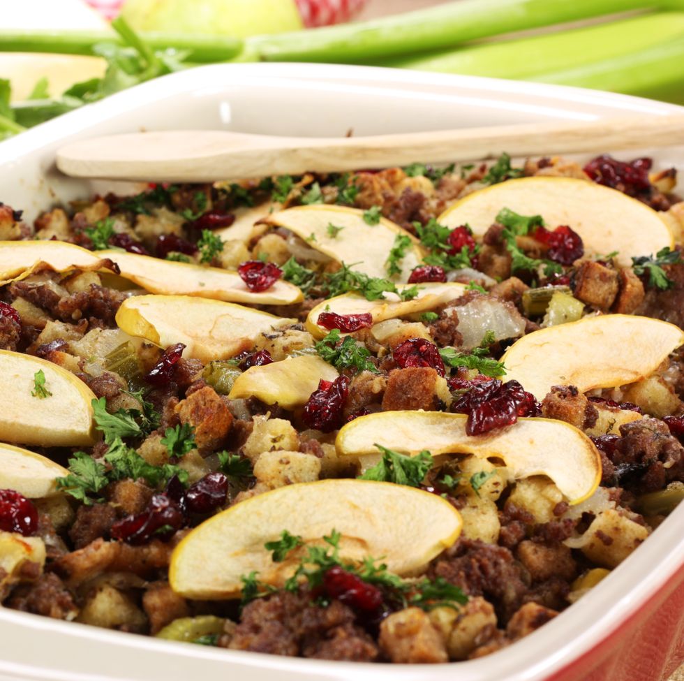 oven dish full with meat stuffing with apple slices