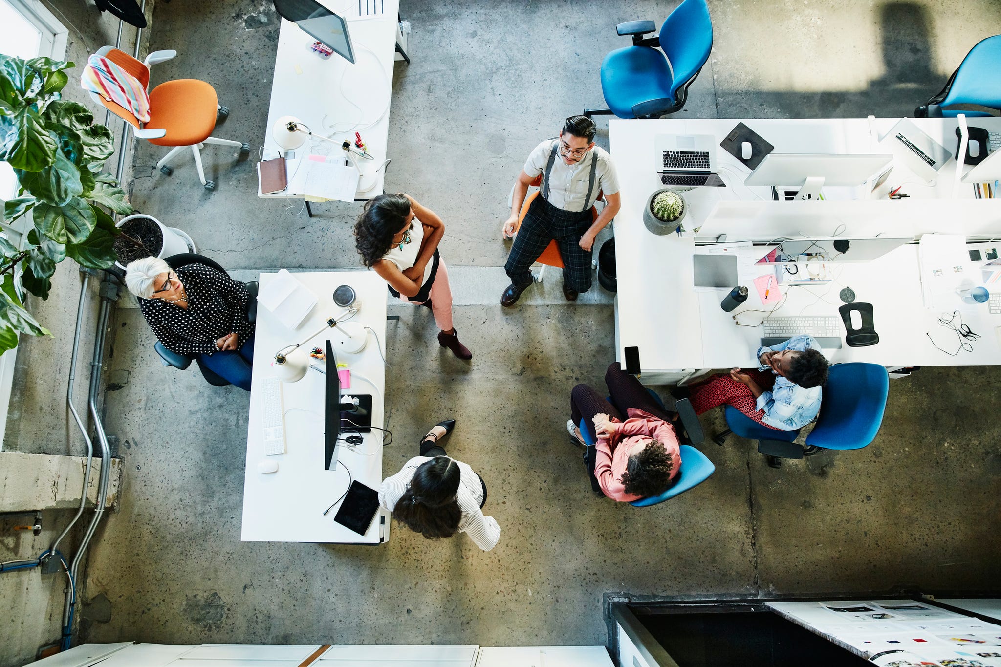 Overhead view of design team having project meeting in office