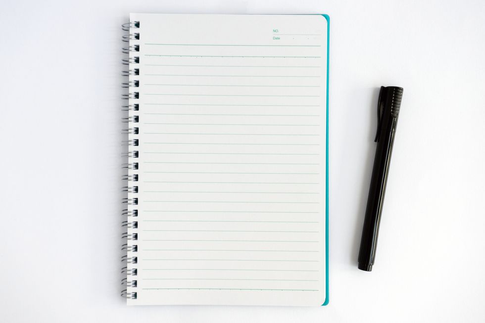 overhead view of note pad and pen