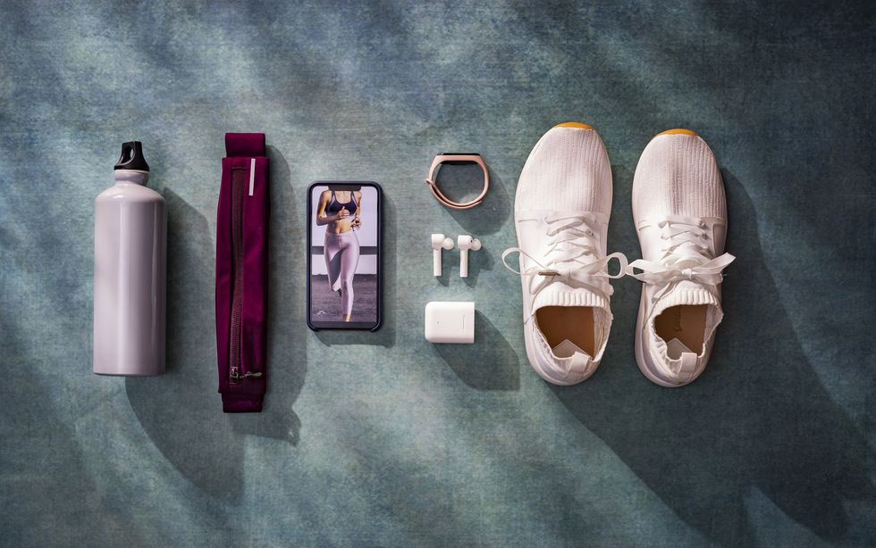overhead view of various fitnessrunning related objects in a flat lay still life composition