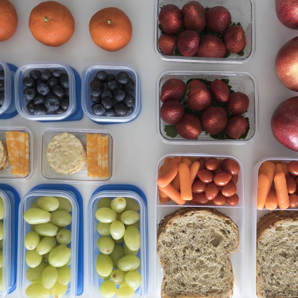 Overhead view prepared healthy snacks and lunches in containers