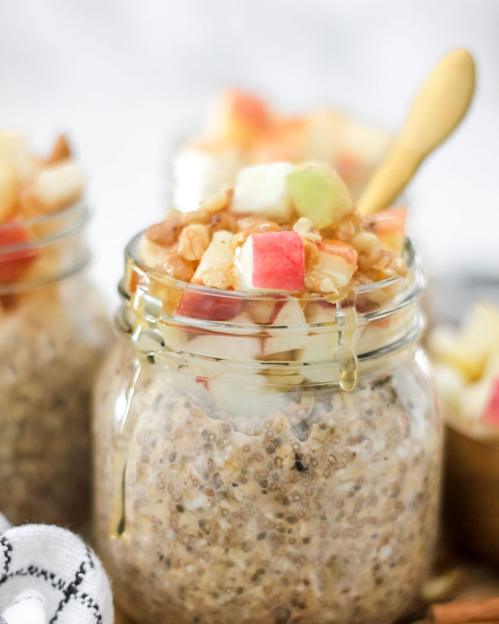 apple cinnamon overnight oats in jar with nuts and honey