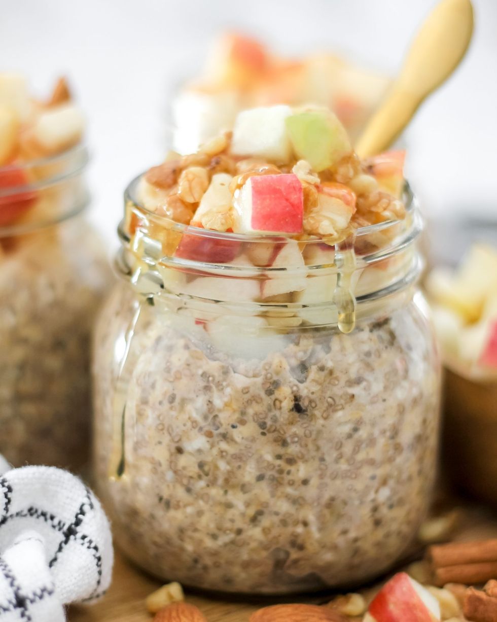 apple cinnamon overnight oats in jar with nuts and honey