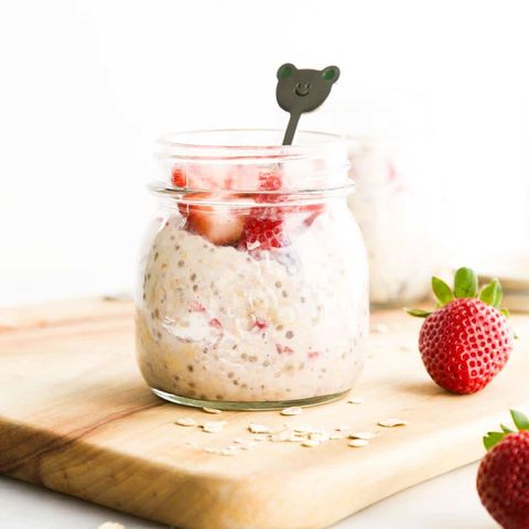 strawberry overnight oats in jar on wood surface