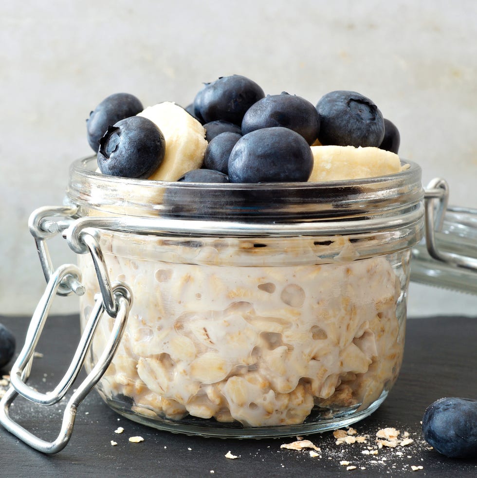 low calorie breakfast Overnight oats with blueberries and bananas, with white and black background low calorie breakfast overnight oats with blueberries and bananas, with white and black background