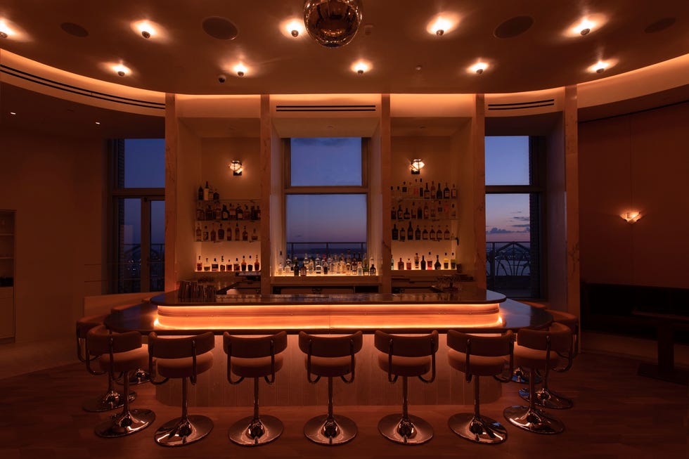 a bar with stools and a bar stool