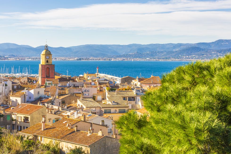 overview of the city of saint tropez with its singular bell tower,