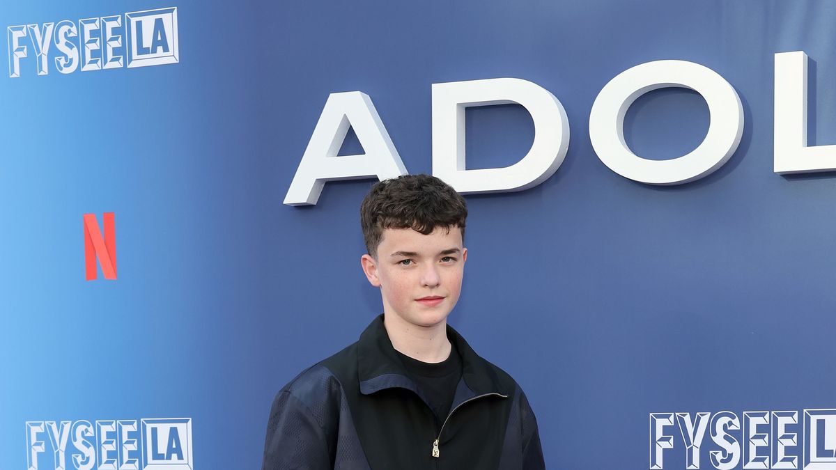 owen cooper smiles wearing blue jacket