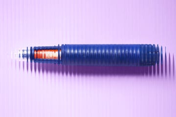 blue pen on a purple background