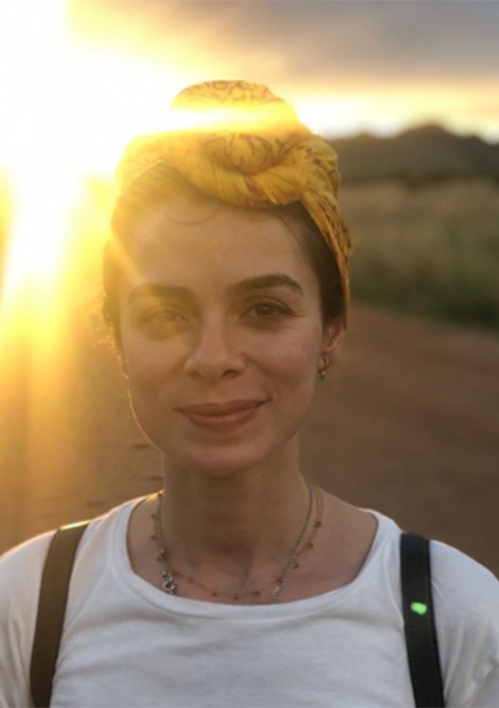 Yellow, Skin, Forehead, Jewellery, Amber, Sunlight, Fashion accessory, Headgear, Beauty, Neck, 