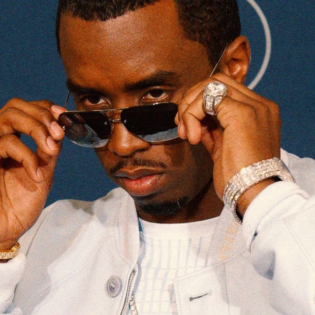 sean combs aka p diddy looks over his glasses on a red carpet