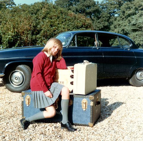 Diana sits on her suitcases as she prepares to go to boarding school at Riddlesworth Hall in the fall of 1970. Distraught over the separation from her home, she told her father, “If you love me, you won’t leave me here.”