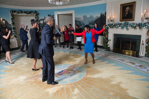 president barack obama and first lady michelle obama dance with social secretary deesha dyer as they celebrate with the social office in the diplomatic reception room of the white house, prior to christmas holiday general reception 7, dec 18, 2015 among those present are kristina broadie, lauren kelly, klevis xharda, ryan vilfer, pany faed, angella reid, daniel shanks and usher's office staff official white house photo by lawrence jacksonthis photograph is provided by the white house as a courtesy and may be printed by the subjects in the photograph for personal use only the photograph may not be manipulated in any way and may not otherwise be reproduced, disseminated or broadcast, without the written permission of the white house photo office this photograph may not be used in any commercial or political materials, advertisements, emails, products, promotions that in any way suggests approval or endorsement of the president, the first family, or the white house