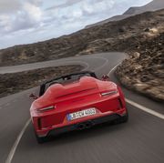 the porsche 911 speedster driving out on the open road