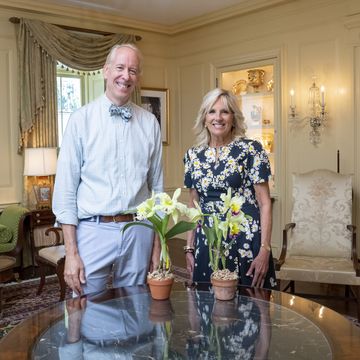 first lady jill biden is presented with a “jill biden orchid” by horticulturalist arthur chadwick in the vermeil room of the white house, tuesday, july 19, 2022 official white house photo by erin scott