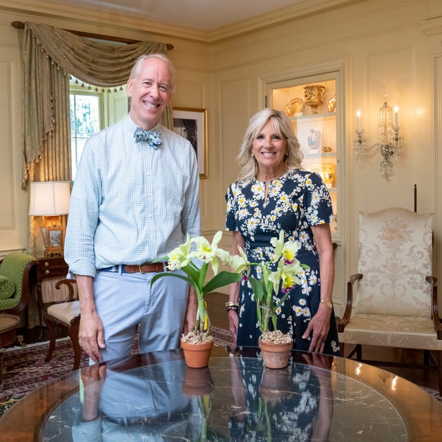 first lady jill biden is presented with a “jill biden orchid” by horticulturalist arthur chadwick in the vermeil room of the white house, tuesday, july 19, 2022 official white house photo by erin scott