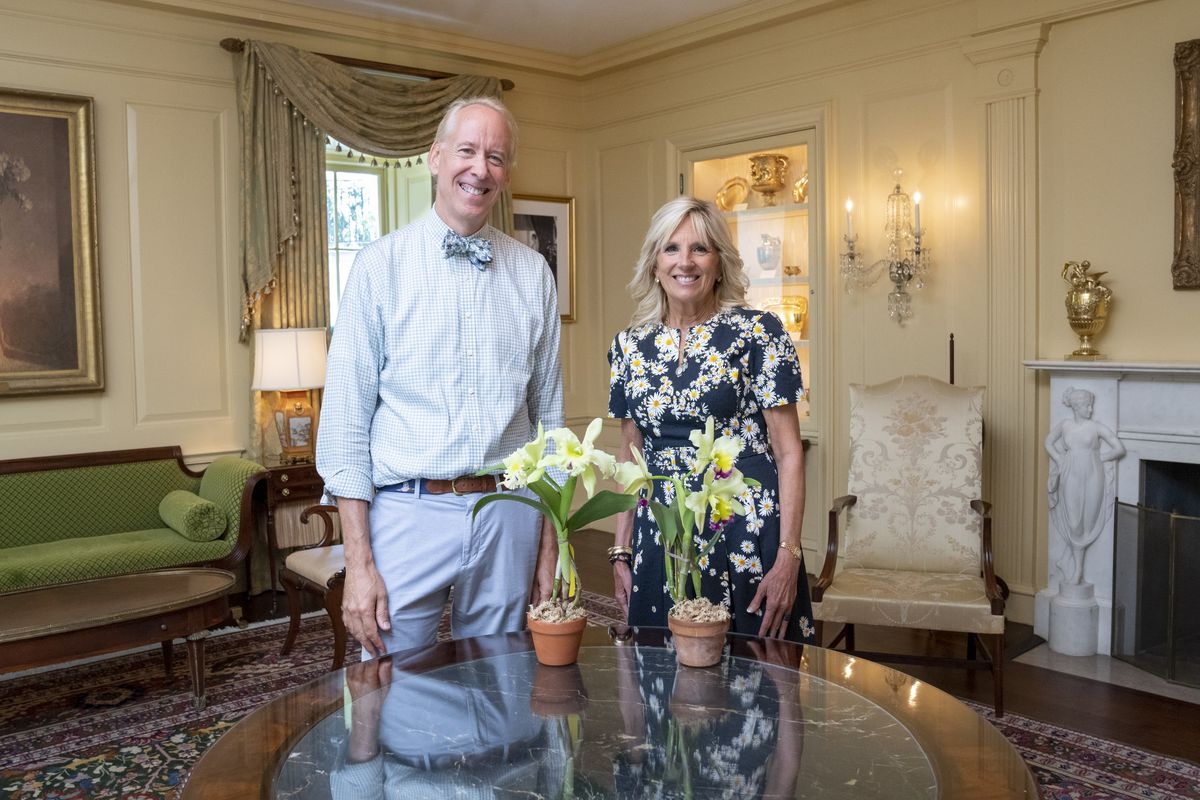 first lady jill biden is presented with a “jill biden orchid” by horticulturalist arthur chadwick in the vermeil room of the white house, tuesday, july 19, 2022 official white house photo by erin scott