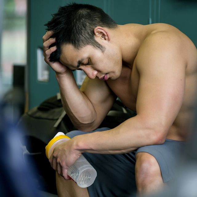 Pacific Islander man resting in gym