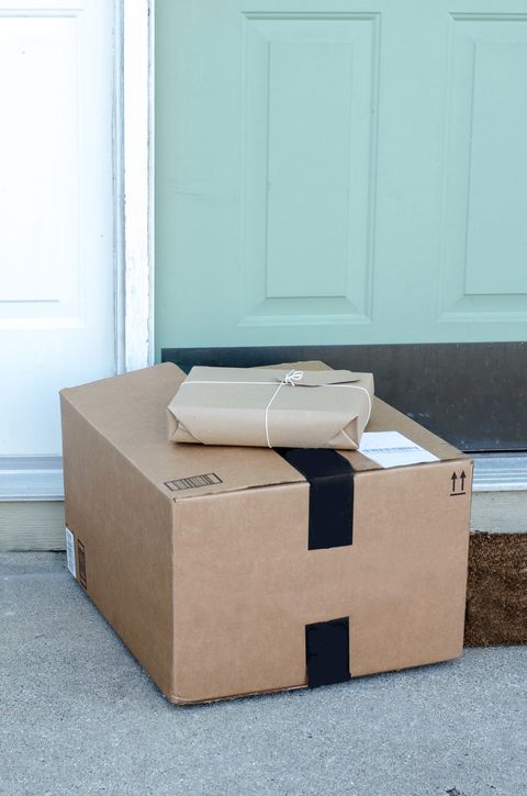packages waiting on the doorstep wrapped in brown paper and tied with string
