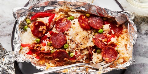 foil packs filled with rice, peas, pepperonis, and peppers