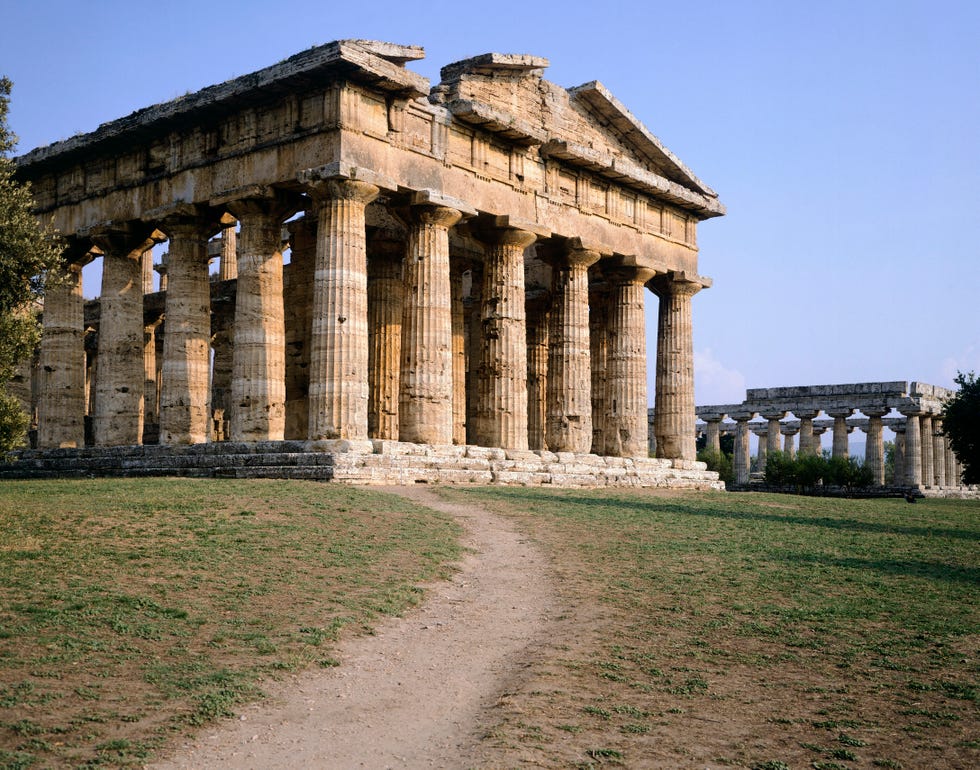italy   march 05  the doric temple of neptune or poseidon, with the basilica in the background, in paestum unesco world heritage site, 1998, campania, italy ancient greek civilization, magna graecia, mid 5th century bc  photo by deagostinigetty images