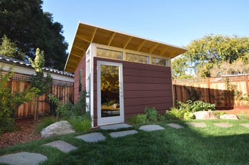 modern small building in a landscaped garden