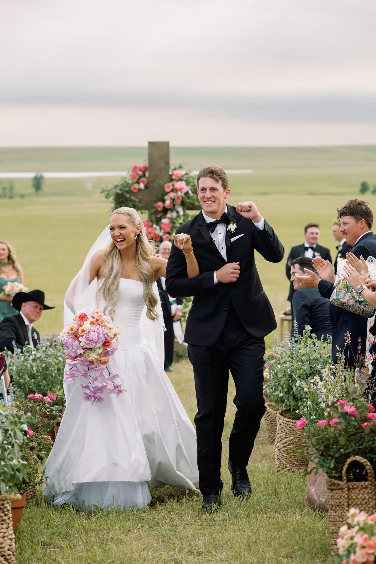 wedding ceremony with a couple walking down the aisle