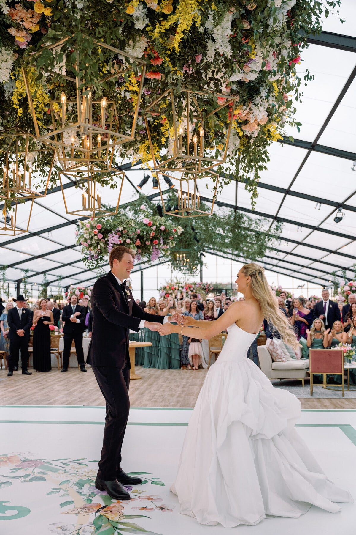 couple exchanging vows during a wedding ceremony in a decorated venue