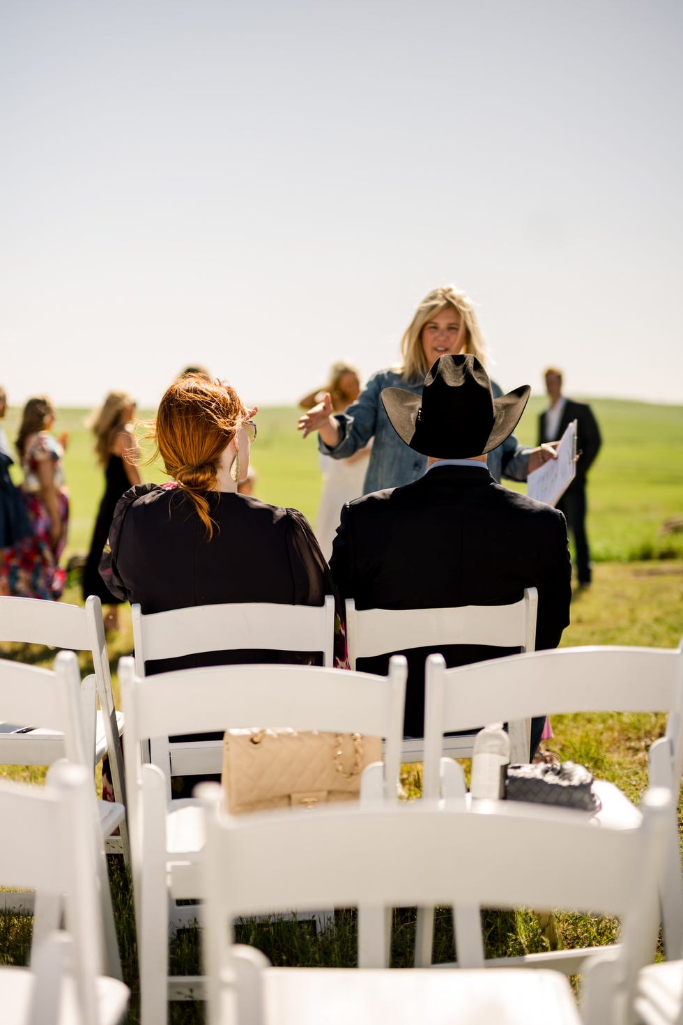 Paige Drummond Wedding Repearsal Outdoor gathering with participants and a speaker