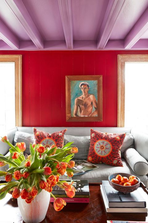 living room with red walls and purple ceiling