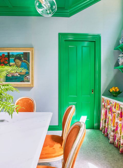 open kitchen with bright green door 