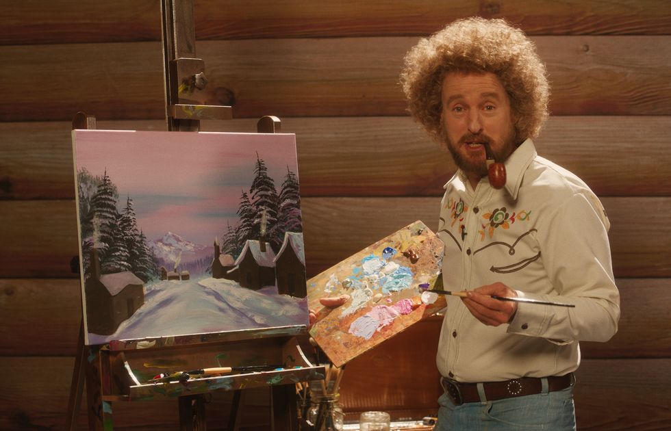 a still from the movie paint, featuring owen wilson with a perm haircut, painting a landscape