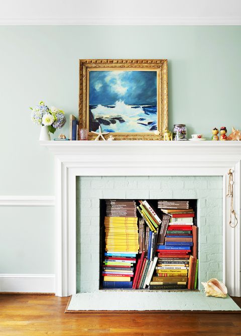 fireplace filled with books