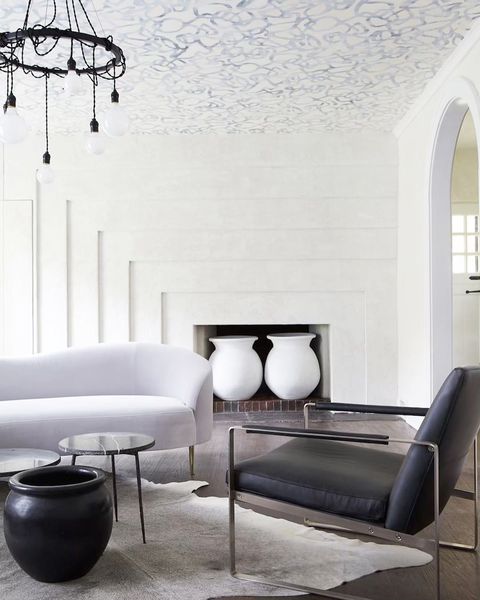 Room, Interior design, Furniture, Living room, Coffee table, Wall, Table, Tile, Floor, Lighting, 