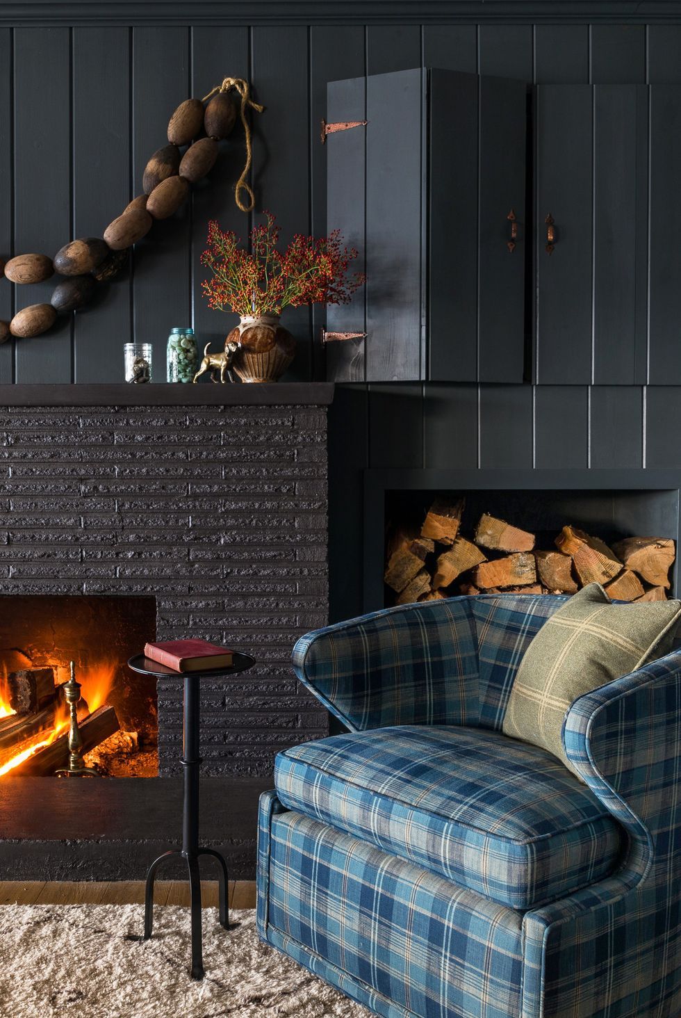 cozy fall fireplace with plaid chair