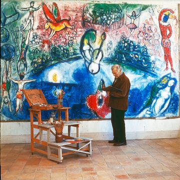painter marc chagall with his picture 'commedia dellarte'