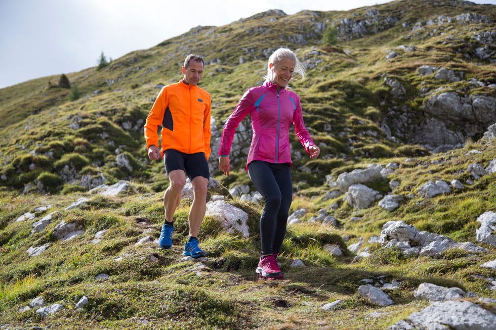 Pair running down the mountain