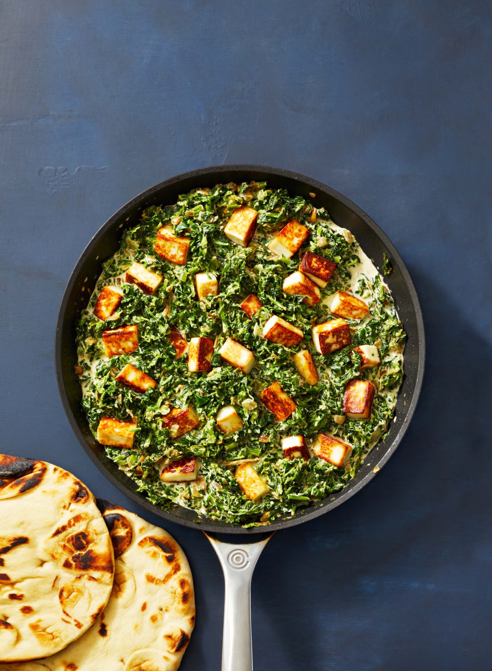 a skillet of palak paneer