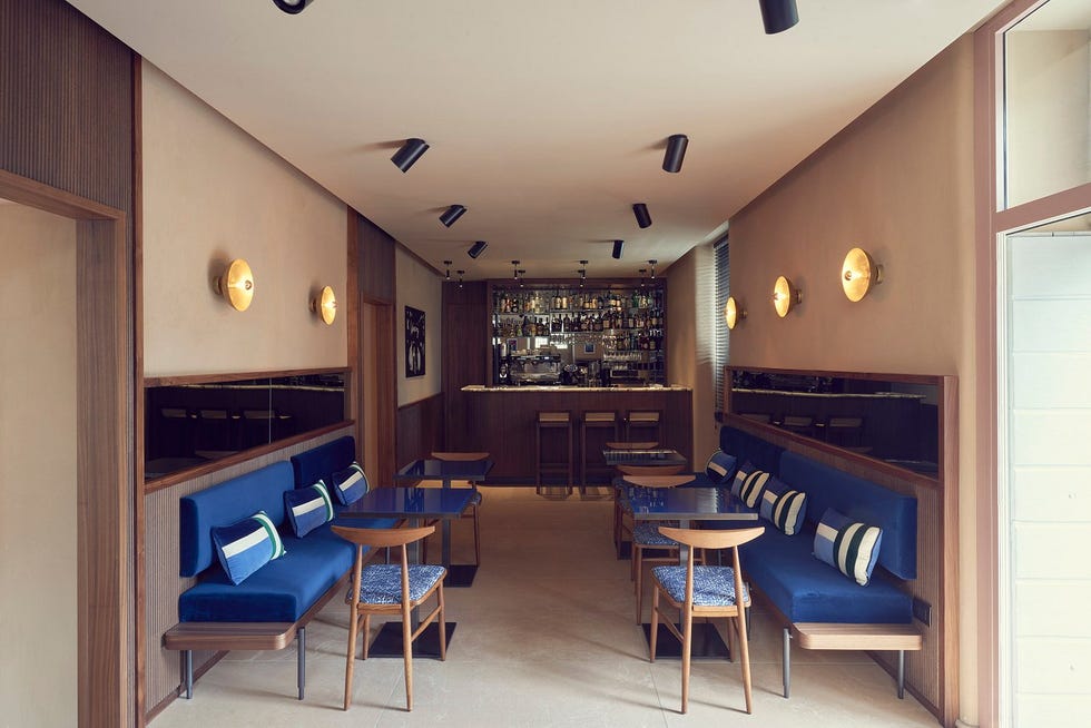 stylish interior of a modern bar with seating and a service area