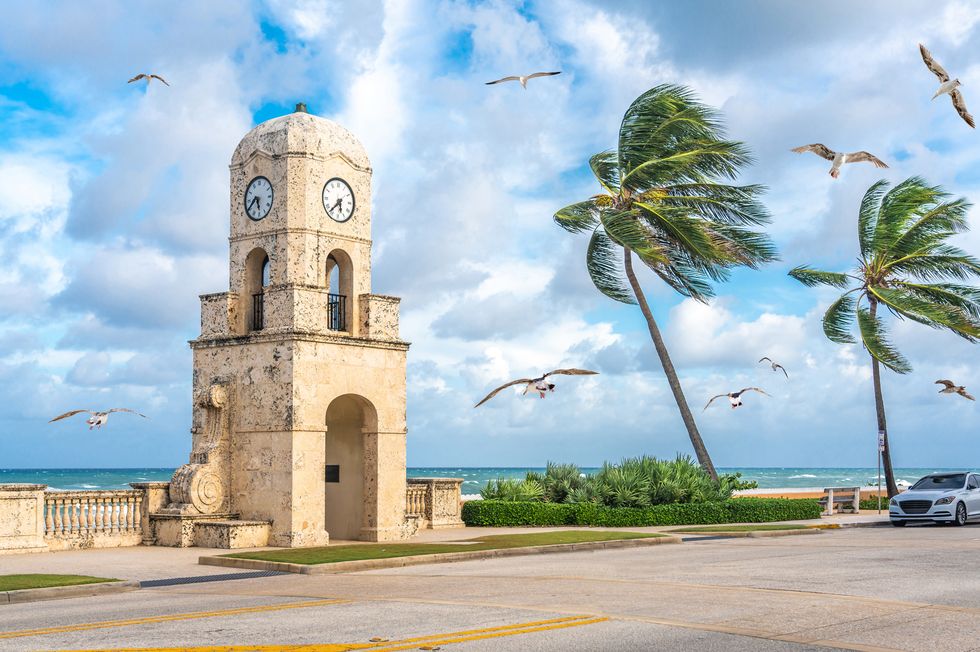 palm beach worth avenue clock tower florida usa with seagulls