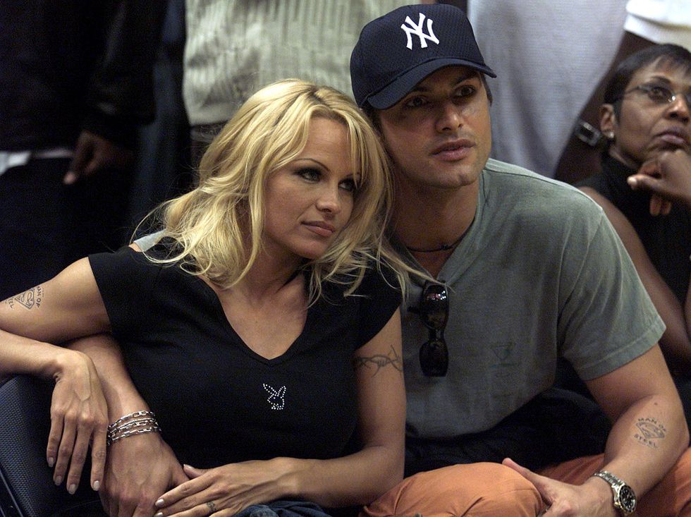 pamela anderson and marcus schenkenberg at nba finals game 2 in los angeles