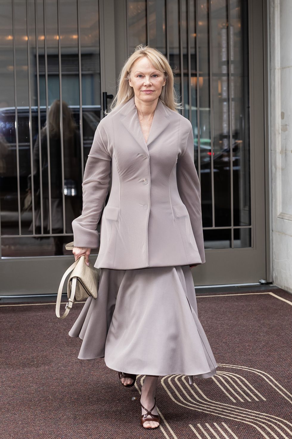 pamela anderson gray outfit 2025