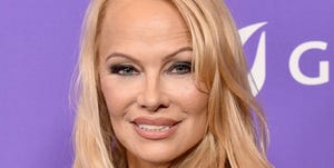 pamela anderson attends the los angeles lgbt center gala at fairmont century plaza on april 22, 2023 in los angeles wearing her hair down and smiling at the camera